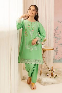 For a chic festive look style our aqua green embroidered shirt featuring a round neckline. Includes: Shirt Only Shalwar Color: Aqua Green Fabric: Cotton Lawn Details: Embroidered Cotton Lawn shirt, Round neckline buttons. Size & Fit: Model Age: 14 Years Model Wears Size: 13/14 Years Designer Green Kurta For Spring, Green Floral Embroidered Kurta For Eid, Eid Kurta With Floral Embroidery In Green, Green Floral Embroidery Kurta For Eid, Spring Green Traditional Wear With Dupatta, Designer Spring Green Salwar Kameez, Turquoise Kurta With Dabka Work For Eid, Turquoise Kurta With Resham Embroidery For Eid, Turquoise Resham Embroidered Kurta For Eid