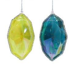 two pieces of glass hanging from chains on a white background, one is yellow and the other is green