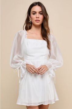 Your sweetness is sure to steal hearts in the Lulus Darling Image White Chiffon Ruffled Off-the-Shoulder Mini Dress! Ultra-lightweight woven chiffon shapes this dreamy dress that has long balloon sleeves (with ruffled elastic cuffs and tie details) that frame an off-the-shoulder neckline. Seamed bodice has a flattering fit, with a high waist and hidden no-slip strips. Skater-style skirt finishes at a mini hem. Hidden zipper/clasp at back. Fit: This garment fits true to size. Length: Mid-thigh. S White Engagement Dresses, White Midi Dress Bodycon, Lulus White Dress, Cute White Dress, Balloon Sleeve Dress, White Long Sleeve Dress, White Dresses For Women, White Chiffon, Dreamy Dress