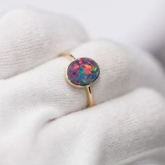 14K Yellow Gold Engagement Ring featuring an Oval Australian Doublet Opal. Free Domestic USPS First Class Shipping! Free One Year Limited Warranty! Free Gift Bag or Box with every order! Opal—the queen of gemstones, is one of the most beautiful and rarest gemstones on earth. Every piece of opals has its colors and patterns, which is perfect for designers to create unique engagement rings for someone extra special. We use 100% Natural & Ethically opal stones (NO synthetics or imitations) for our jewelry. ---------------------------------------------------------------ABOUT THIS PRODUCT14K Yellow Gold, Australian Doublet Opal, 1.15 ctMetal Color: GoldenOpal Color: Red, Yellow, Green & BlueRing Surface Measures: 11x9 MMRing Size: 7Occasion: Engagement/Birthday/Anniversary---------------------- Yellow Gold Opal Ring With Round Stone As Gift, Round Opal Gemstone Ring As Gift, Fine Jewelry Opal Ring For Gifts, 14k Gold Oval Birthstone Ring As Gift, Oval 14k Gold Birthstone Ring Gift, Gold Oval Opal Birthstone Ring, Oval 14k Gold Birthstone Ring As A Gift, 14k Gold Oval Cabochon Birthstone Ring, Gold Opal Ring With Oval Cabochon Birthstone