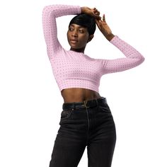 This long-sleeve crop top is made of recycled polyester and elastane, making it an eco-friendly choice for swimming, sports, or athleisure outfits. The crop top has a tear-away care label and a wide, double-layered waistline band for a comfortable fit. • Fabric composition in Europe: 88% recycled polyester, 12% elastane • Fabric weight in Europe: 6.78 oz/yd² (230 g/m²) • Fabric composition in Mexico: 81% REPREVE recycled polyester, 19% LYCRA® XTRA LIFE™ • Fabric weight in Mexico: 7.52 oz/yd² (255 g/m²) • UPF 50+ • Trendy, cropped fit • Wide, double-layered waistline band • Raglan sleeves • Tear-away care label • Size up if you’re between sizes as this fabric can be tight on the body • Blank product components in Europe sourced from Spain • Blank product components in Mexico sourced from Co Fitted Pink Cropped Sweater, Pink Fitted Cropped Sweater, Pink Fitted Long Sleeve Cropped Sweater, Trendy Long Sleeve Workout Crop Top, Fitted Long Sleeve Crop Top In Athleisure Style, Fitted Long Sleeve Crop Top Athleisure, Fitted Long Sleeve Crop Top For Athleisure, Athleisure Long Sleeve Crop Top For Spring, Fitted Long Sleeve Crop Top For Workout