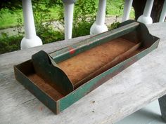 an old box sitting on top of a wooden table