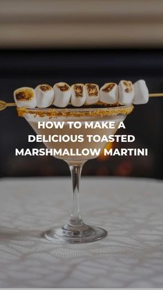 a martini with marshmallows in it and the words how to make a delicious toasted marshmallow martini