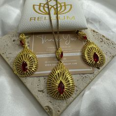 Elevate Your Style with ReluumJewellery's Country Map Pendant Necklaces: Introducing our Habesha Ethiopian Jewelry Set, a dazzling ensemble inspired by the rich cultural heritage of Ethiopia. Crafted with intricate designs and vibrant colors, this set features a stunning necklace and matching earrings, exquisitely adorned with traditional Habesha motifs and craftsmanship. Each piece is a testament to the beauty and elegance of Ethiopian jewelry, reflecting centuries of tradition and artistry. Wh Gold Teardrop Jewelry Sets For Celebration, Red Gold-plated Jewelry Set For Wedding, Gold Plated Jewelry With Matching Earrings For Celebration, Handmade Ruby Jewelry Sets, Plated Teardrop Earrings As Gift, Plated Teardrop Earrings For Gifts, Handmade Ruby Jewelry Sets In Elegant Style, Elegant Gold Jewelry Sets With Drop Earrings, Teardrop Plated Jewelry As A Gift