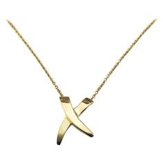 Tiffany & Co. Paloma Picasso 18K Yellow Gold Graffiti "X" Necklace- The universal symbol for a kiss, this elegant "X" pendant necklace is crafted in classic 18K yellow gold by Paloma Picasso for Tiffany & Co. Size: 15 mm x 10 mm (pendant) 16 inches (necklace) Hallmark: T&CO. 750 Paloma Picasso Weight: 1.9 dwt./ 3.0 gr. Very good condition, professionally polished. Will come packaged in a gift box or pouch (when possible) and will be shipped U.S. Priority Mail Insured. DV04292417KCS Gold Graffiti, Gold Heart Bracelet, 16 Inch Necklace, Paloma Picasso, Greek Jewelry, Gold Cross Pendant, Contemporary Pendant, Heart Pendant Diamond, Modern Necklaces