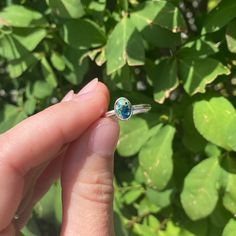 We crush the varying Leland Blue stones that we find and we include a variety of stones colors in each ring. This ring is completely sealed making it UV proof, waterproof, durable and designed to be low profile making it perfect for everyday wear. Each ring will look slightly different due to natural variances in Leland Blue stones, but we make sure that each one is amazing! Available in sizes 5-11. (Note that these rings are handmade, please allow up to 1/4 variance in sizing.) Leland Blue is s Everyday Oval Stackable Rings With Birthstone, Blue Turquoise Stackable Open Ring, Adjustable Oval Sapphire Birthstone Ring, Adjustable Oval Sapphire Ring As Birthstone, Everyday Sapphire Ring Jewelry, Blue Stackable Jewelry For Everyday, Blue Stackable Everyday Jewelry, Sterling Silver Stackable Topaz Ring Fine Jewelry, Adjustable Sterling Silver Sapphire Ring