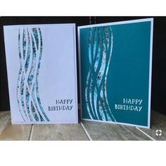 two greeting cards with blue and white swirls on them, one has a happy birthday card