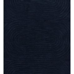 a dark blue rug with wavy lines on it