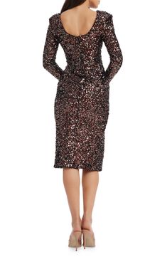 Turn heads in this glamorous dress designed in dazzling allover sequins with a dipped back and a stem-showing side vent. 44 1/2" length Bateau neck Long sleeves Lined 95% polyester, 5% spandex Hand wash, dry flat Imported Sequined Sheath Midi Dress For Evening, Evening Sequined Sheath Midi Dress, Glamorous Sequin Midi Dress For Gala, Glamorous Evening Midi Dress With Sequins, Glamorous Formal Midi Dress With Contrast Sequin, Evening Sheath Midi Dress With Sequins, Glamorous Sequined Bodycon Dress For Formal Events, Formal Evening Sequined Bodycon Dress, Elegant Contrast Sequin Fabric For Holiday Party