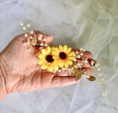 A chic and effortless addition to your bohemian bridal look, this exquisite headband is the perfect accessory for a wedding with a sunflower theme. Adorned with a combination of glowing crystals, white pearls, tiny enameled leaves, and of course sunflowers, it gives your hair an extra touch of glam to finish off your perfect look on your perfect day. Length: 9" (approx. 22.8cm). Width: 2" (approx. 5cm). The vines with leaves and pearls are flexible and they can be molded in any shape based on yo Sunflower Theme, Crystals White, Bridal Sunflowers, Bridal Hair Accessory, Bohemian Bridal, Bridal Headband, Bridal Hair Accessories, Perfect Day, Wedding Hair Accessories