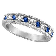 a white gold ring with blue and white stones on the sides, set in 18k white gold