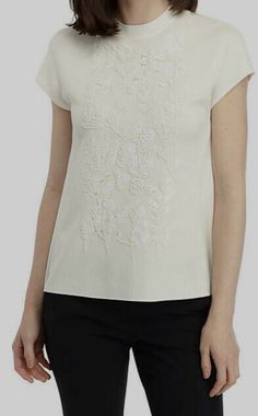 $320 Anne Klein Womens White Floral Mock Neck Embellished Viscose Sweater Size S Description Emphasized by beading in the shapes of flowers, this cap sleeve sweater from Anne Klein will be a versatile piece for year-round wear. Product Details Exposed zip closure Mock neck Short set-in sleeves Imported Product Specifications 27 in Length Material & Care Viscose Hand wash or dry clean for best results About Us We sell only 100% authentic clothing from new with tags to gently used. We have a 100% Elegant Beige Crew Neck Blouse, Elegant Cream Crew Neck Top, Elegant Cream Top With Floral Embroidery, Elegant Embroidered Beige Tops, Elegant Embellished Beige Tops, Elegant Beige Embellished Tops, Elegant Floral Embroidered Crew Neck Top, Elegant Crew Neck Top With Floral Embroidery, Embellished Cream Tops For Spring