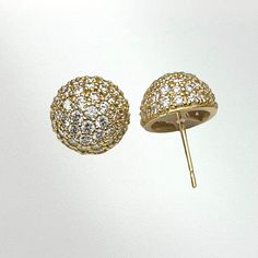 *THIS PAIR IS SOLD BUT CAN BE RE-MADE AS CUSTOM IF ORDERED BY 12/04/24* Cast in 18k yellow gold. These look dainty but pack a lot of bling! These studs are a convex dome shape to maximize the surface area for the diamonds. The pair of studs features over 100 x 1.5mm white diamonds weighing it at a total of 1.5 carats. The diamonds are set in a traditional bead-set pattern known as pavé. Each pavé dome stud measures .45 inches on the ear. - 18K yellow gold - 1.5mm white diamonds - 1.52ctw F-G col Luxury Yellow Gold Cluster Earrings, Luxury Gold Cluster Earrings With Brilliant Cut, Dazzling Yellow Gold Round Diamond Earrings, Dazzling Gold Brilliant Cut Diamond Earrings, Yellow Gold Diamond Earrings With Sparkling Stones, Gold Round Cut Single Cut Diamond Earrings, Gold Single Cut Round Diamond Earrings, Luxury Gold Round Diamond Earrings, Luxury Gold Cluster Earrings With Diamond Accents