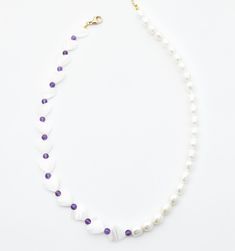 A subtle pop of color on your pearl necklace, this Amethyst studded necklace will have your heart. Alternating Pearl hearts, Amethyst beads, and freshwater pearls will quickly become the best feature of any outfit. White Beaded Amethyst Jewelry, White Pearl Heart-shaped Beaded Necklaces, White Pearl Heart-shaped Beaded Necklace, White Heart-shaped Pearl Beaded Necklace, White Beaded Heart-shaped Pearl Necklace, Purple Pearl Single Strand Jewelry, Purple Single Strand Pearl Jewelry, Heart-shaped White Beaded Necklace With Pearl Charm, White Heart-shaped Pearl Necklace With Charm