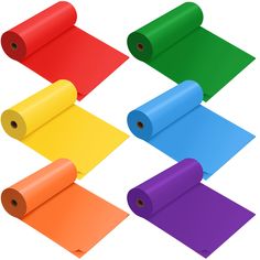 six rolls of colored paper laid out on top of each other