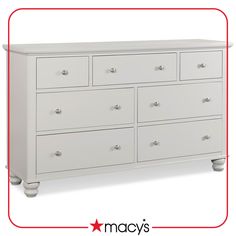 a white dresser with six drawers and two red stars on the bottom drawer, which reads macy's