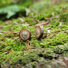 "Sweet little wood slice earrings sourced from my forest in rural NY, hand painted with little daisy flowers. I use different types of wood for these earrings, making each pair unique! Tiny tree rings can be seen, and they are sealed with a protective varnish, and have an attached sterling silver post and ear nut. Earrings are approximately 1/4\" wide. Choose the earring pair you want based on the photos, if you want a closer up photo of a certain pair please let me know! Please note while these Wood Flower Earrings, Flower Shaped Natural Color Jewelry For Gifts, Flower Shaped Natural Jewelry For Gift, Natural Color Flower Jewelry For Gifts, Nature-inspired Flower Earrings For Birth Flower Gift, Nature-inspired Flower Earrings With Birth Flower For Gift, Nature-inspired Flower Earrings, Rustic Hand Painted Jewelry Gift, Rustic Hand Painted Jewelry For Gifts