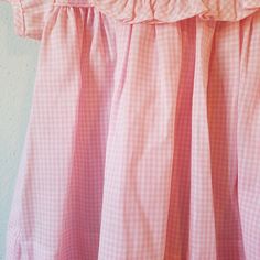 "- This gorgeous vintage dress is ready to be worn again! It is pink gingham with short sleeves and buttons at back of neck. There is a large, round collar trimmed in gingham ruffles. The white on collar is embroidered with pink flowers with greens and a bow. So perfect for Easter. size is: 9 months (2 available) Length: 13.75\" + 3\" hem allowance" Short Sleeve Plaid Dress With Ruffles For Picnic, Short Sleeve Checkered Plaid Dress With Ruffles, Gingham Ruffled Dress For Daywear, Gingham Ruffle Dress For Daywear, Gingham Plaid Dress With Ruffles For Daywear, Gingham Dress With Ruffles For Daywear, Cute Gingham Dress With Short Sleeves, Cute Short Sleeve Plaid Dress For Picnic, Cute Plaid Short Sleeve Dress For Picnic