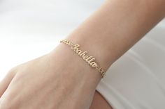 "14k Solid Gold Name Plate Bracelet/Personalized Name Bracelet/Gold Name Bracelet/Handmade Name Bracelet With Curb Chain Perfect gift for birthday, anniversary, christmas, bridesmaid, graduation, wedding, engagement, best friend, mom and sisters. ---> All of our products are made of high quality of 14k Gold. It is not gold plated or filled ---> Please add your name in personalization box Item Specification --> Material: 14k Solid Gold --> Charm Size: 30x7mm --> Charm Thickness: 0.6mm --> Curb Wi Personalized Fine Jewelry Bracelets For Everyday, Elegant Handmade Nameplate Jewelry, Yellow Gold Name Bracelet For Gift, Yellow Gold Name Bracelet Gift, Dainty Engraved Bracelet Jewelry, Handmade Yellow Gold Sterling Silver Bracelets, Handmade Yellow Gold Bracelets, Elegant Anniversary Name Bracelet, Elegant Handmade Rose Gold Chain Bracelet