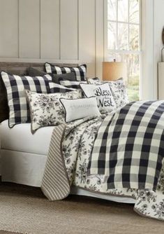 a bed with black and white checkered comforter