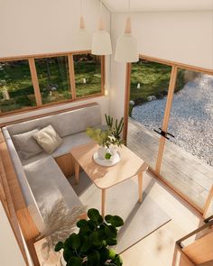 a living room filled with furniture and lots of windows