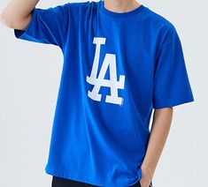 MLB NY/LA Los Angeles Dodgers Basic Big Logo Printing Sports Round Neck Short Sleeve T-shirt Unisex Blue 31TS09031-07U Athleisure Tops For College In Spring, Spring Athleisure Tops For College, Sportswear Cotton Tops With Letter Print, Blue Urban Crew Neck Tops, Urban Blue Crew Neck Top, Blue Moisture-wicking Sportswear T-shirt, Blue Sportswear T-shirt For Sports Season, Collegiate Tops For Sports Events In Spring, Collegiate Tops For Spring Sports Events