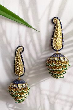 Blue Kundan and Pearl Handpainted Meenakari Jhumka Earrings | Etsy Luxury Bollywood Earrings With Zari Work, Luxury Intricate Design Jhumkas, Luxury Kundan Tikka With Meenakari Details, Luxury Jhumkas With Intricate Design, Luxury Meenakari Temple Jewelry Chandelier Earrings, Luxury Hand-set Green Jhumkas, Luxury Gold Jhumkas For Navratri, Luxury Festive Earrings With Zari Work, Luxury Bridal Meenakari Earrings For Festivals