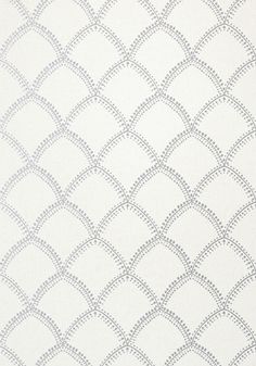 an upholstered white and grey fabric with wavy lines on the side, as well as small dots