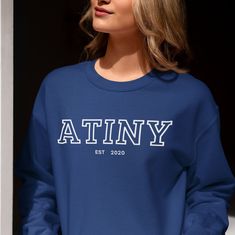 Ateez Atiny Sweatshirt, Kpop Atiny Custom Merch, Personalized Kpop Crewneck Sweatshirt, Gift for Atiny Ateez, Kpop Sweater, Ateez Merch, Atiny Custom Year ♡ Our Product ♡ Made from premium, soft fabric, it's perfect for everyday wear or showing your love for BTS at concerts and gatherings!! ♡ 50% Cotton 50% Polyester ♡ Ultra Soft, Super Comfy, Durable and Stylish. Eco friendly. ♡ Sizing Questions? ♡ Please refer to the Size Chart in the Listing Photos to find your correct size. ♡ Measurements ar Casual Long Sleeve Sweatshirt With Name Print, Casual Fitted Letter Print Sweatshirt, Blue Tops With Name Print For College, Casual Crew Neck Sweater With Name Print, Fitted Long Sleeve Top With Name Print, Blue Crew Neck Sweatshirt With Name Print, Blue Long Sleeve T-shirt With Name Print, Fitted Crew Neck Sweater With Letter Print, Casual Blue Sweatshirt With Name Print