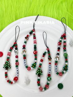 christmas beaded necklaces on a white plate