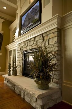 there is a large clock on the mantle in this living room