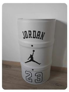 a white bucket with the name jordan on it and a basketball ball in the middle