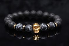 Men's skull bracelet lava stone stretch bracelet with obsidian and hematite and stainless steel skull - the perfect gift for cool friends bracelet golden black grey pearl stretch bracelet This handmade men's lava stone skull bracelet is a perfect combination of rebellious punk rock and modern style. The bracelet is made of high-quality obsidian and hematite beads set in an elastic band. It is a practical accessory that adapts effortlessly to the wrist and goes with any cool style. The golden sta Black Skull Bracelets For Streetwear, Black Skull Print Jewelry For Streetwear, Skull Shaped 8mm Bead Jewelry Gift, Casual Skull Jewelry For Gifts, Casual Skull-shaped Jewelry For Gifts, Casual Skull-shaped Jewelry Gift, Casual Skull-shaped Gift Jewelry, Skull Bracelet Men, Friends Bracelet