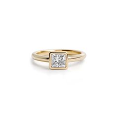 Minimalist 18k yellow gold ring featuring a prominent 1.4 carat princess cut diamond. Yellow Engagement Rings, The Lover, Understated Luxury, Princess Cut Diamond, Princess Diamond, Princess Cut Diamonds, Pendant Earrings, Princess Cut, Diamond Rings