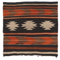 an old navajo rug with red, brown and white designs on it's sides