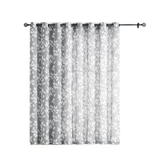 the curtain with white flowers on it is hanging in front of a white wall and black rod