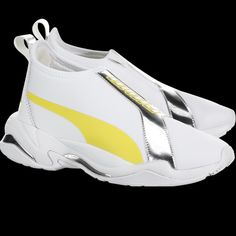 The Puma Thunder Trailblazer Metallic Is A Fashion Forward Sneaker With A Popular Chunky Design. Designed With A Laceless Upper, They Also Have A Medial Zipper, Pull Tab, Metallic Accents, And A Rubber Outsole. Sporty Yellow Sneakers With Puma Logo, Yellow Sporty Sneakers With Puma Logo, Yellow Slip-on Sneakers For Sports, Modern Puma Running Sneakers, Puma High-top Running Shoes, Yellow Puma Sneakers For Running, Sporty Yellow Puma Sneakers, New Puma Sneakers, Puma Thunder