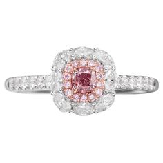 GIA Certified Fancy Light Purplish Pink Diamond Engagement Ring Introducing an exquisite ladies' diamond ring that exudes elegance and luxury, perfect for marking special occasions or as a timeless piece of everyday sophistication. This stunning diamond ring features a center stone that is GIA certified Fancy Light Purplish Pink diamond, weighing 0.25 carats. The captivating pink diamond is expertly cut to showcase its unique hue and sparkle, making it the focal point of this beautiful ring. Sur Graff Pink Diamond Ring, Pink Sapphire Engagement Rings, Pink Diamonds Engagement, Radiant Cut Diamond Ring, Pink Diamond Engagement Ring, Pink Cushion, Stunning Diamond Rings, Cushion Cut Diamond Ring, Fancy Light