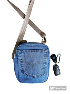 Lots of pockets on this upcycled Levis denim bag.  A back pocket from the jeans on the front, a zipper pocket on the back, and a slip pocket on the inside makes this the ideal bag for every day.   This will easily hold your phone, keys, some makeup, and sunglasses.   Three D-Rings allow you to use this bag as a shoulder bag or a crossbody. Staps easily attached using swivil hooks.  The lining is two tone gray fabric with a slip pocket (perfect for a phone) and has a light blue binding.   If you like this, check out what else I have in my shop. https://cottonandblueco.etsy.com Everyday Denim Shoulder Bag With Zipper, Denim Blue Shoulder Bag With Zipper For Everyday Use, Denim Shoulder Bag With Zipper For Travel, Denim Blue Shoulder Bag With Pockets For On-the-go, Denim Blue Crossbody Shoulder Bag With Pockets, Medium Wash Shoulder Bag With Pockets For Travel, On-the-go Denim Shoulder Bag With Zipper Pocket, Casual Denim Shoulder Bag With Zipper Pocket, Casual Denim Shoulder Bag For On-the-go