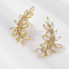 Introducing New Earrings “Ella” Cubic Zirconia Leaf Stud Brand : Sana Officials Insta : Sana_.Officials Based In Ny Deliver All Over Us Gold Bridal Earrings With Prong Setting For Evening, Yellow Gold Diamond Earrings With Sparkling Stones For Party, Yellow Gold Diamond Earrings For Party, Party Yellow Gold Diamond Earrings With Sparkling Stones, Elegant Gold Plated Earrings With Rhinestones, Gold Plated Diamond Earrings For Party, Elegant Gold Crystal Earrings With Prong Setting, Sparkling Gold-plated Earrings For Party, Party Crystal Earrings With Cubic Zirconia Plating