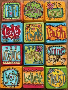 colorful magnets with different sayings on them