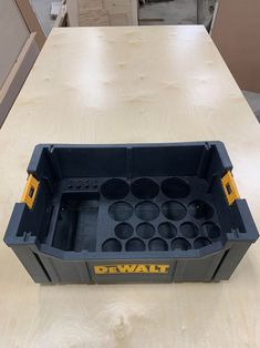 a tool box sitting on top of a wooden table