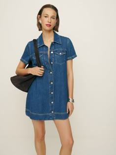 Denim time. Shop the Harlee Denim Mini Dress from Reformation, a mini-length dress with a collared neckline, button front, and short sleeves. Denim Zara Dress, Dark Denim Dress Outfit, Denim Babydoll Dress, Denim Dress Vintage, Short Denim Dress, Mini Denim Dress, Denim Short Romper, Thrift Wishlist, 2024 Lookbook