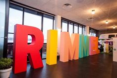 the word rmm spelled out in multicolored letters