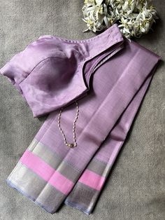 Kimaya lilac silk saree  Pure silk saree Thread weaving border and striped body Handloom Attached  blouse piece with BORDER 6.2 metres light weight zero zari To view more kanchi silk sarees, pls click on https://aavaranaa.com/kanchipuram-silk-sarees/ Lilac Silk Saree, Isha Borah, Draping Blouse, Thread Weaving, New Saree Designs, Saree Draping