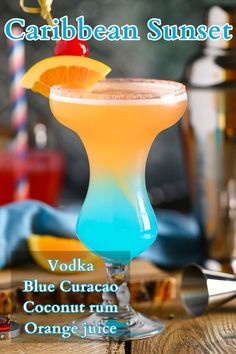 a blue curacao cocktail garnished with an orange slice