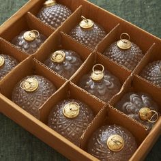 a box filled with lots of different sized ornaments