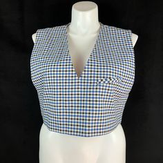 Crop Style Top Or Vest With 1 Welt Chest Pocket. Deep V-Neckline. Fully Lined. Chest Approx. 42" Length Approx. 18" 65% Polyester 32% Rayon (Viscose) 3% Elastane(Spandex) Houndstooth Blue Black Off White Retro V-neck Vest For Spring, Chic Sleeveless Plaid Top, Fall Gingham V-neck Top, Retro V-neck Fitted Vest, Retro V-neck Top For Workwear, Gingham V-neck Tops For Spring, Spring Gingham V-neck Top, Plaid Summer Tops For Work, Fitted Gingham V-neck Top