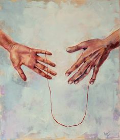 two hands reaching out to each other over a string