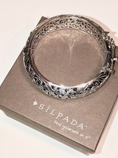 "B1829 Silpada Hinged Bangle Bracelet Silpada hinged sterling silver bangle bracelet with a box clasp and safety chain. Fits up to a 7 1/2\" wrist. New for $349 before the company went out of business. In excellent new condition, comes with a gift box and can be gift wrapped on request! GORGEOUS gift for you or your loved one! Silver Sisters After Party! Let's Keep the Silpada Party Going!" Ornate Hinged Bangle Bracelet, Luxury Formal Bracelet With Oxidized Finish, Ornate Hinged Bangle Bracelets, Wedding Bracelet Jewelry With Box Clasp, White Gold Cuff Bracelet Bangle With Sterling Silver Clasp, Elegant Oxidized Finish Cuff Bracelet For Formal Occasions, Ornate Hinged Cuff Bangle Bracelet, Ornate Hinged Bracelets For Gifts, Formal Sterling Silver Bracelets With Box Clasp